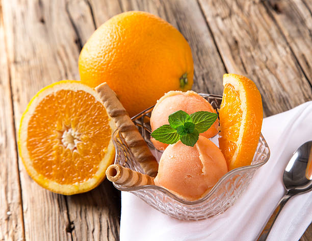 istock Ice cream scoops on wooden table. 499665799