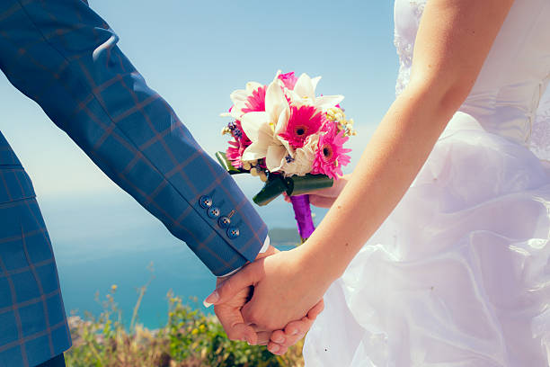istock Young married couple holding hands 499666569