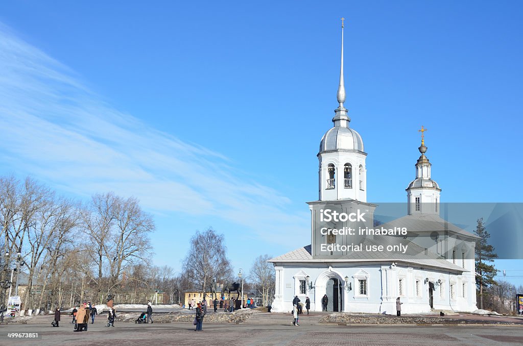 Russia Scene: People walking near Church of Alexander Nevsky, Vologda Vologda, Russia, March 09, 2014,Russia Scene: People walking near the Church of Alexander Nevsky on Cathedral square in Vologda, 18 century Christianity Stock Photo