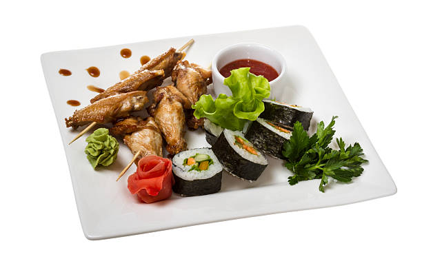 istock Buffalo chicken wings on plate with sushi 499673903