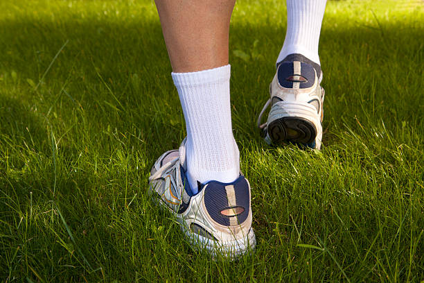 istock Men's feet in sneakers 499674529
