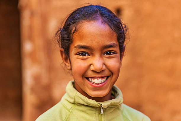Beautiful Muslim girl in Moroccan kasbah Beautiful Muslim girl in Moroccan Village near Ouarzazate, Morocco, Africa moroccan girl stock pictures, royalty-free photos & images