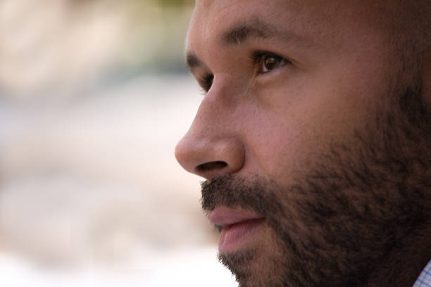 istock Profile portrait of young bearded man with pensive expression 499676083