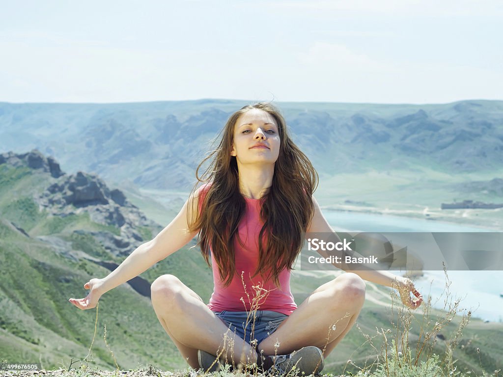 Young women at nature Portrait of young caucasian beautiful sport  women in summer nature on the background of river in blue pants Adult Stock Photo