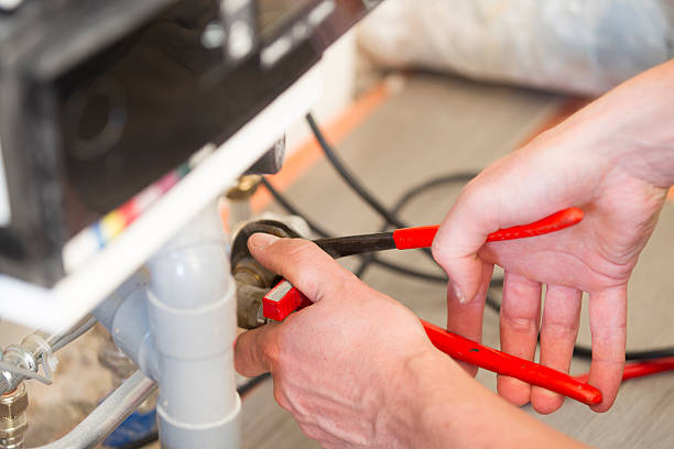 istock Plumber repairing a heater in house 499678829