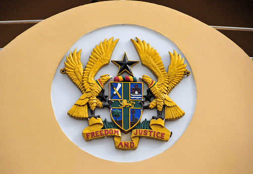 Accra, Ghana: Ghana coat of arms, two golden Tawny eagles, shield and black star - detail of the Gateway Arch on Independence / Black star square - photo by M.Torres