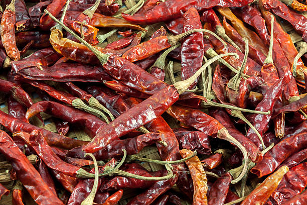 istock chili dried on wood basket background. 499686042