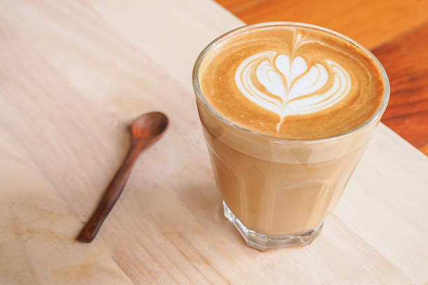istock Cup of art latte on a cappuccino coffee Selective Focus 499686484