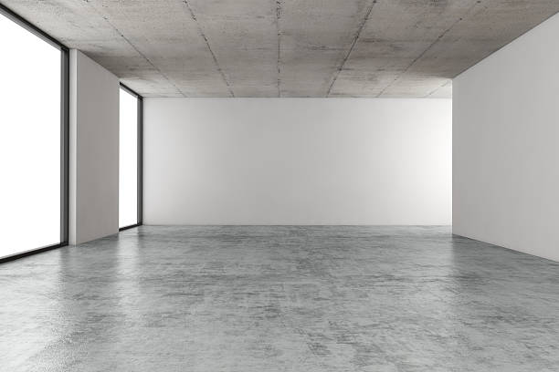 Empty office space Empty large office space with concrete ceiling and floor, illuminated by natural light from windows.  flooring stock pictures, royalty-free photos & images