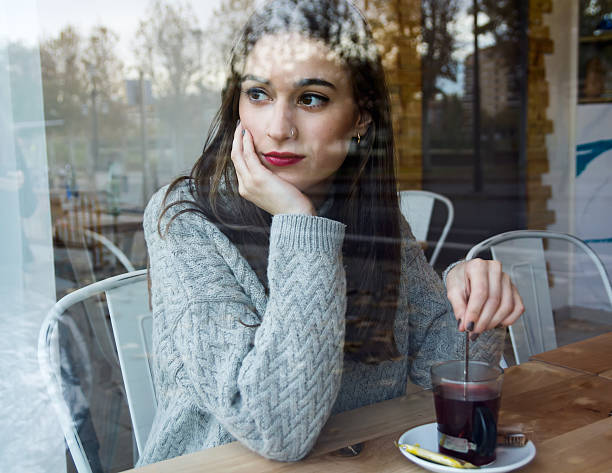 istock Beautiful young woman drinking tea in a coffee shop. 499686556