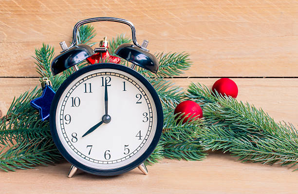 istock Vintage Clock with christmas tree twigs of spruce 499688998
