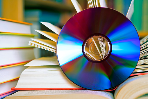 CD and books close-up (digital audiobook concept)