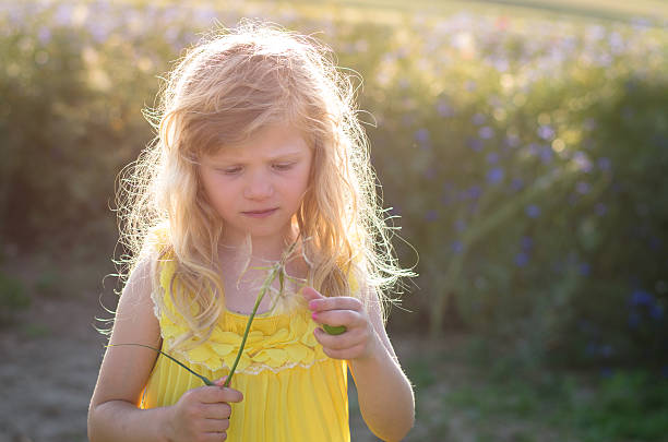 istock blond girl at sunset 499690998