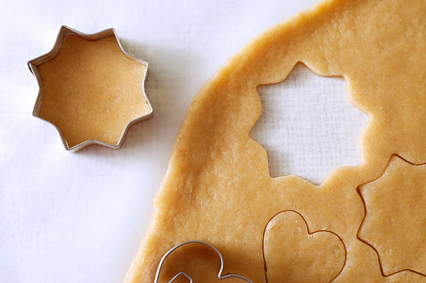 istock Dough rolled out and cookies cut out 499691242