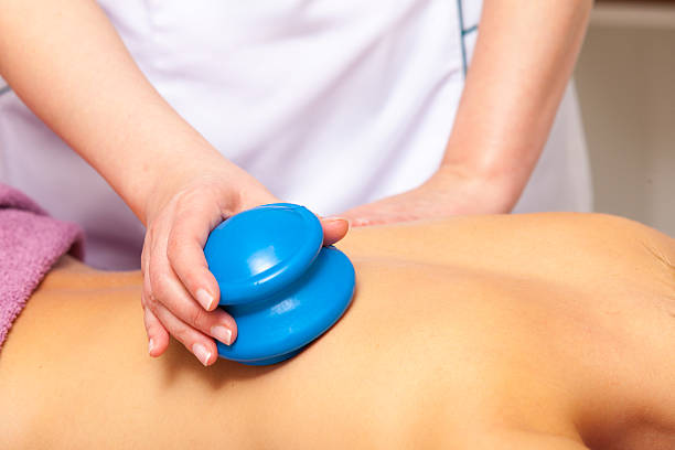 Beauty salon. Woman getting spa cupping glass vacuum massage Beauty treatment concept. Woman getting spa therapy cupping glass vacuum massage in salon. Alternative medicine procedure, body care healthy lifestyle. cupping therapy stock pictures, royalty-free photos & images