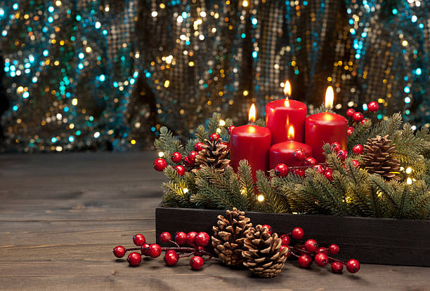 Three red Candles Three red Candles with Christmas tree branches and pine cones decorated advent candle wreath christmas stock pictures, royalty-free photos & images