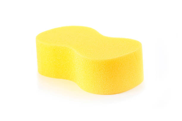 istock Sponge over white background. Yellow household cleaning spong 499693685