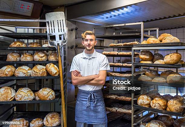 Baker In His Bakery Baking Bread Stock Photo - Download Image Now - Baker - Occupation, Bakery, Bread