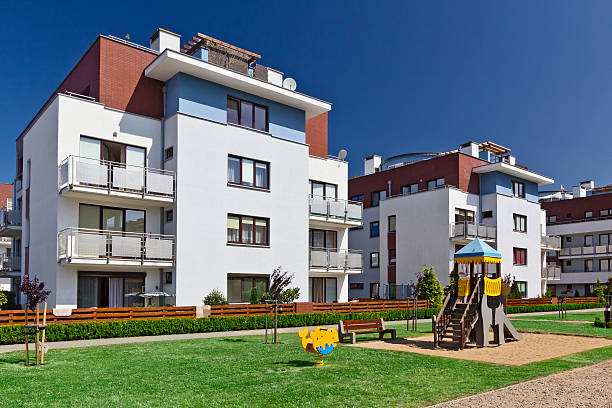 istock Modern Condo buildings with playground 499695101