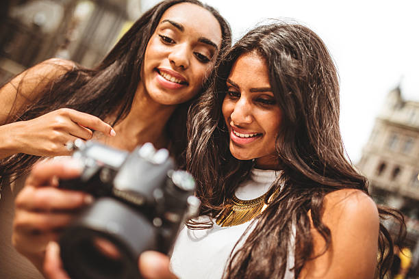 istock tourist looking the pictures on camera 499695213