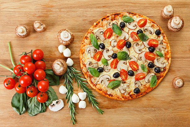 istock Top view Pizza with mushrooms and vegetables 499696076