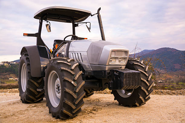 istock Gray tractor parked at dawn. 499696920