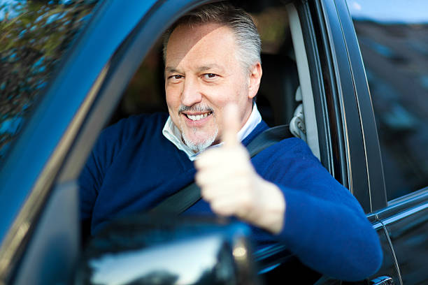 istock Senior driving his car 499697301