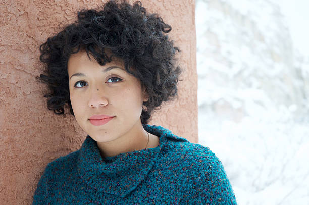 Young Woman in Winter A young, multi-ethnic woman outdoors in winter. short weave hairstyles stock pictures, royalty-free photos & images