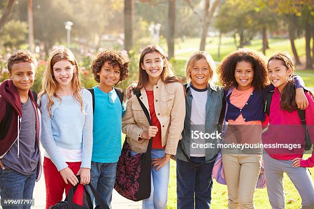 Group Of Young Children Hanging Out In Park Stock Photo - Download Image Now - Child, Girls, Multiracial Group