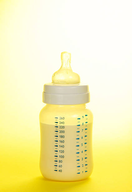 istock Small bottle for feeding of the child 499700997