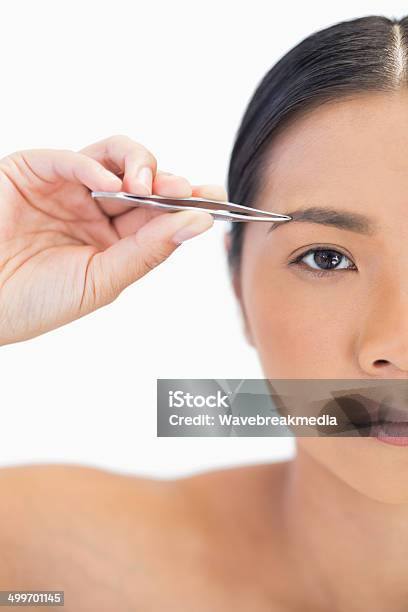 Half Face Of Natural Woman Using Tweezers Stock Photo - Download Image Now - 20-29 Years, Adult, Adults Only