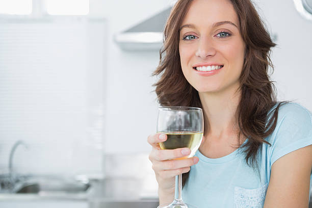 istock Pretty brunette having a glass of wine 499701153