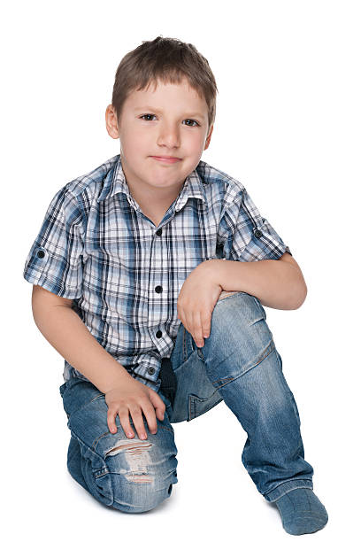 istock Little boy sits on the floor 499716137