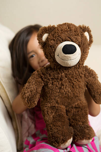 istock Little girl with a teddy bear 499716371