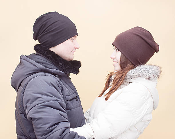 istock Young couple looking at each other in winter 499716793