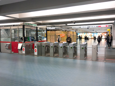 Montreal, PQ, Canada - December 3, 2015: People at a subway ticket gates