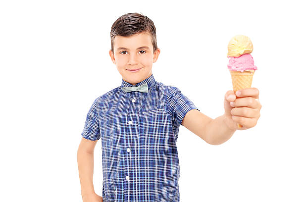 istock Cute little boy holding an ice cream 499717219