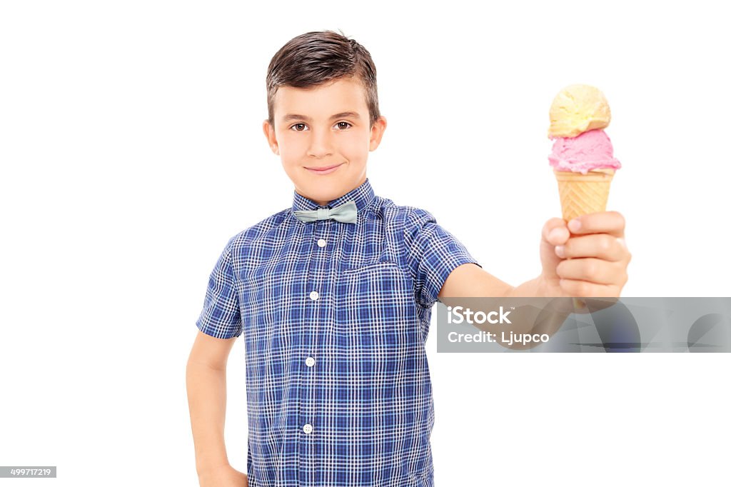 Cute little boy holding an ice cream Cute little boy holding an ice cream isolated on white background Bow Tie Stock Photo