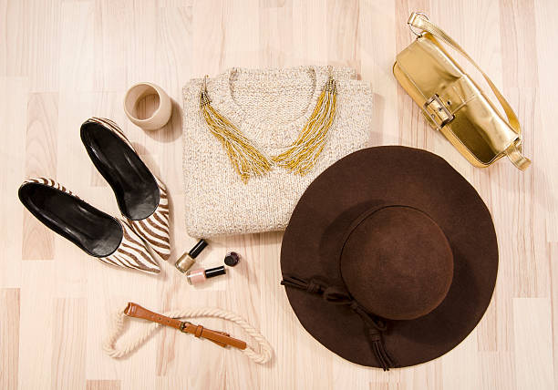 istock Winter sweater and accessories arranged on the floor. 499718080