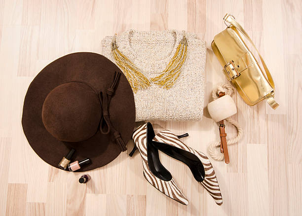 istock Winter sweater and accessories arranged on the floor. 499718174