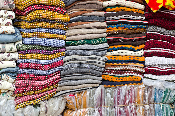 istock Colorful stacked fabric in  big market , India 499719199