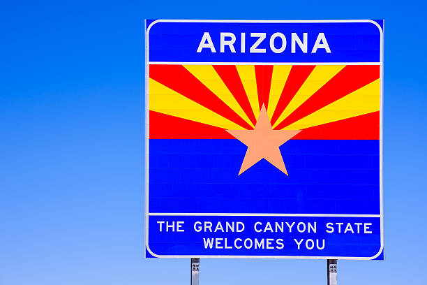 istock Arizona State Welcome Sign on highway - blue sky 499720203