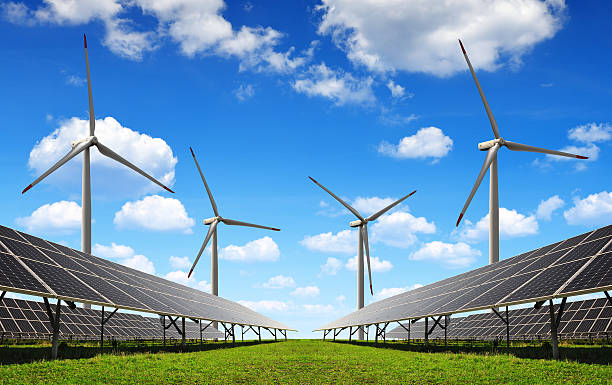 istock Solar energy panels with wind turbines. 499721064