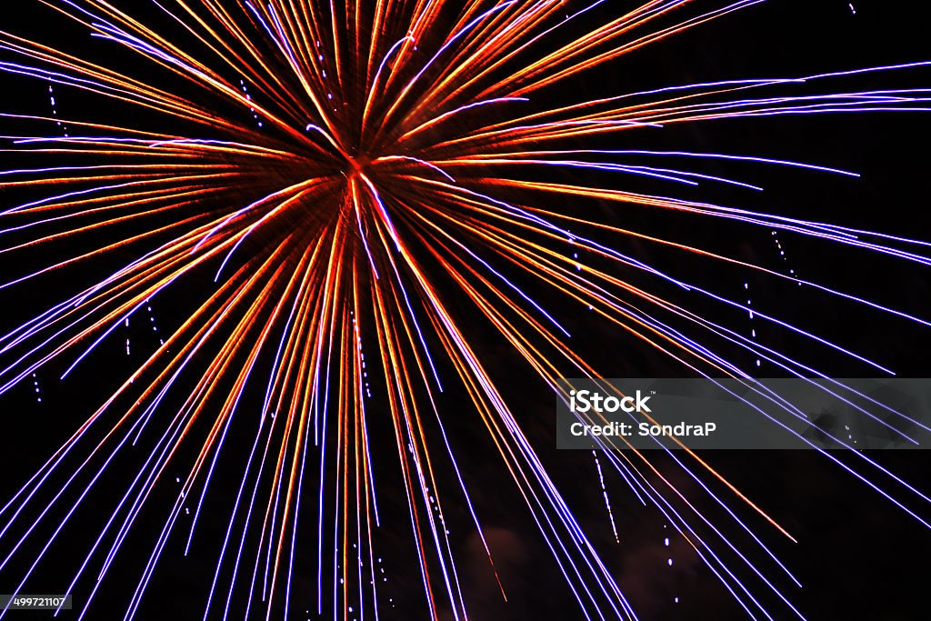 Purple and Gold Fireworks Bright fireworks on black sky.   For more of my fireworks (CLICK HERE) Black Color Stock Photo