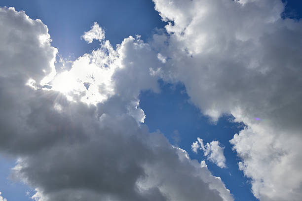 istock Cloudscape with the sun rays radiating from behind the rainy 499721734