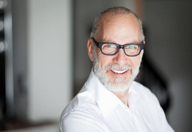 Senior Man Smiling At The Camera stock photo