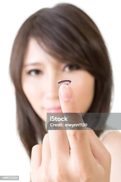 Young Asian Woman With Lens In Her Hand Stock Photo - Download Image Now - Adult, Brown Hair, Close-up
