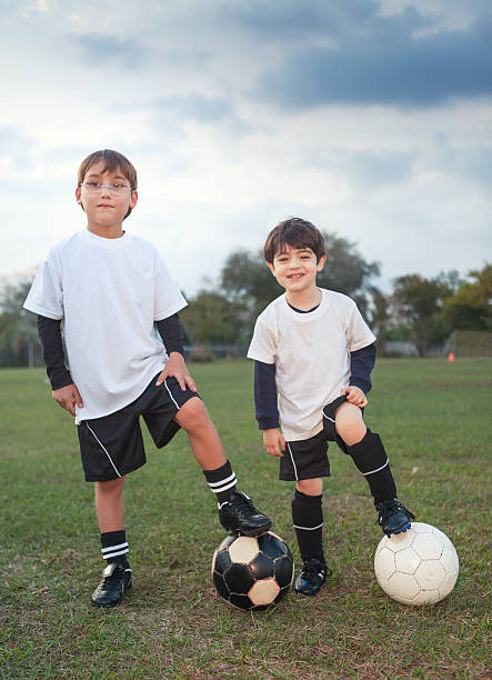 istock Kids possing with soccer balls 499723603