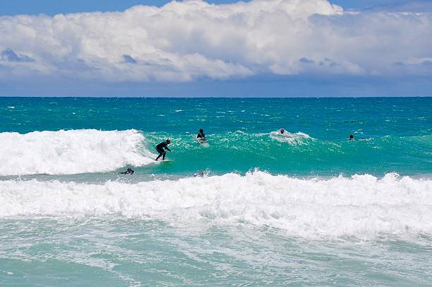 Scarborough,WA,Australia-November 30, 2013: People surfing the Indian Ocean waves at Scarborough Beach in Australia