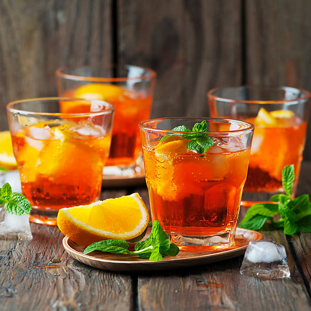 istock Glass of aperol with ice, orange and mint 499728986